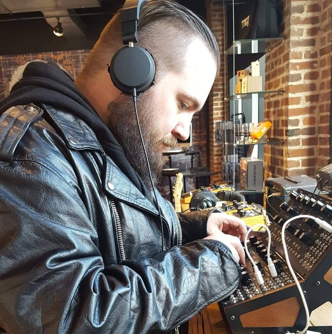 Ryan working with modular synthesizer
